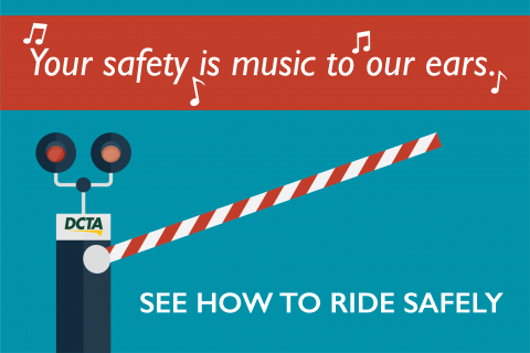 Illustration of rail crossing with text "your safety is music to our ears!"